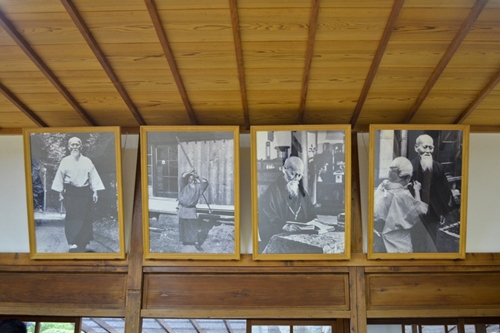 Photographs of Morihei Ueshiba displayed at the dojo